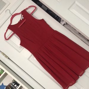 Red Delia’s dress pleated